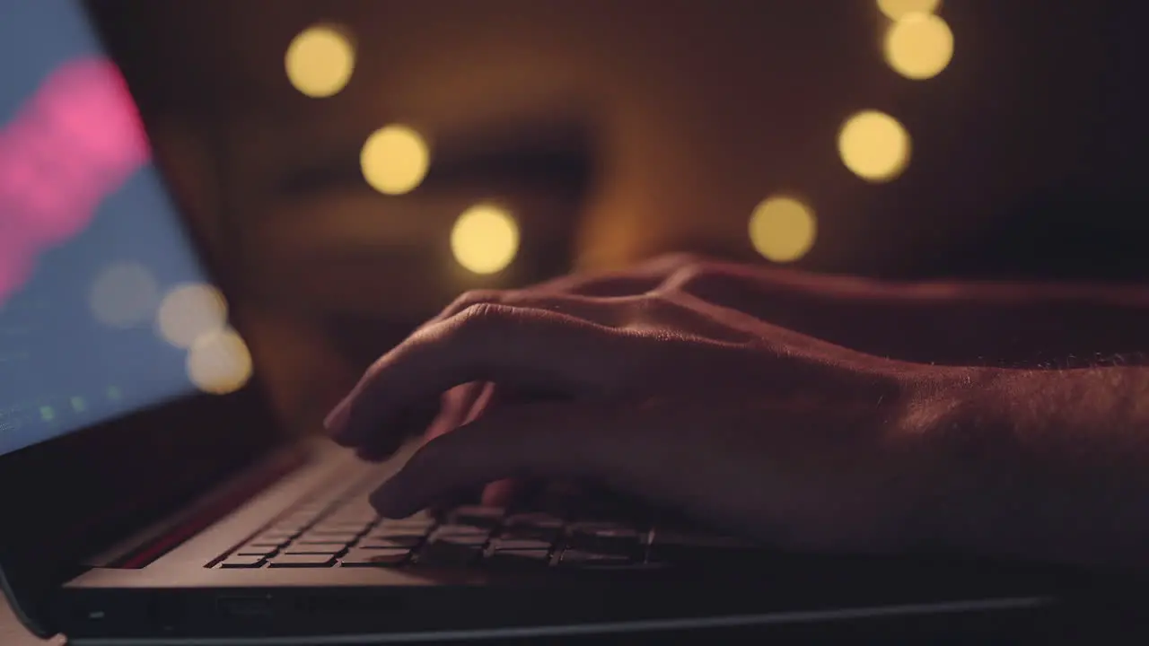 Close up hands developing software app using digital laptop computer typing and coding code on laptop computer screen