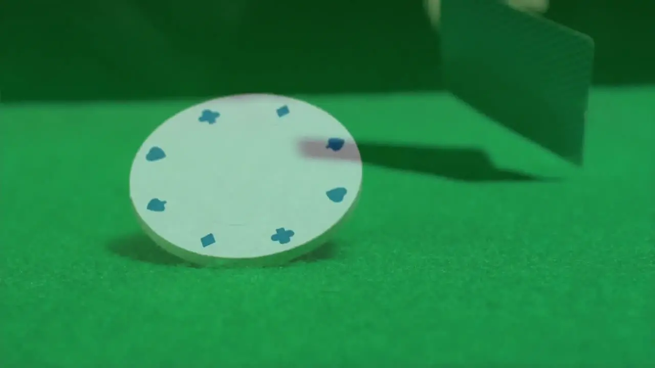  Poker cards and chip on a green poker table