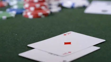 Extreme Close Up Shot of Poker Player Turning Over Pocket Aces