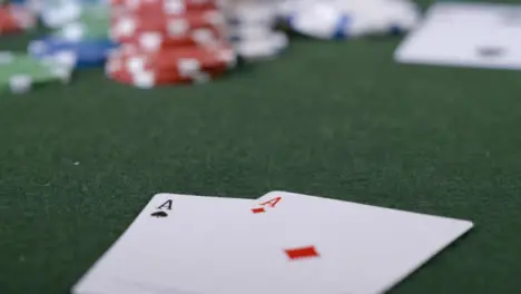 Extreme Close Up Shot of Poker Player Going All In and Turning Over Pocket Aces