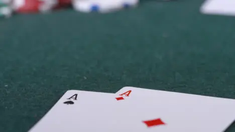 Extreme Close Up Shot of Poker Player Going All In and Revealing Pocket Aces