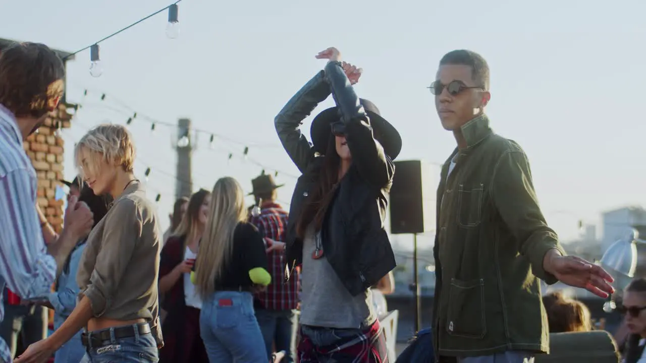 Happy Young Group Of Friends Dancing And Having Fun At The Daytime Rooftop Party Outdoor