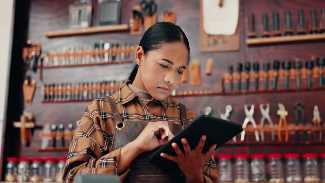 Leather factory woman in with tablet