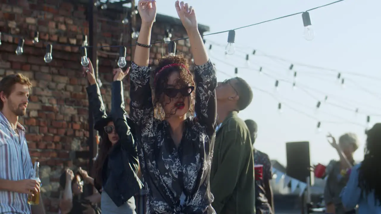 Young Stylish Woman Dancing And Gaving Fun On The Rooftop