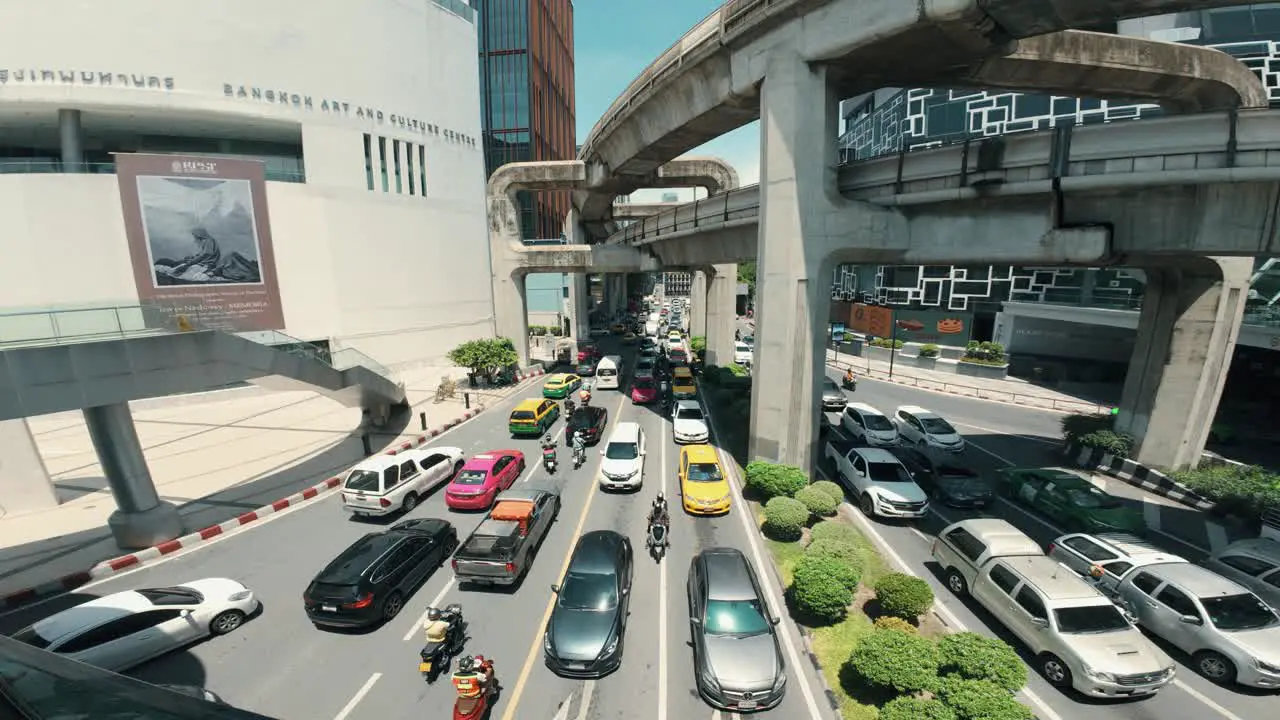 Cars navigating through the bustling streets of Bangkok Thailand