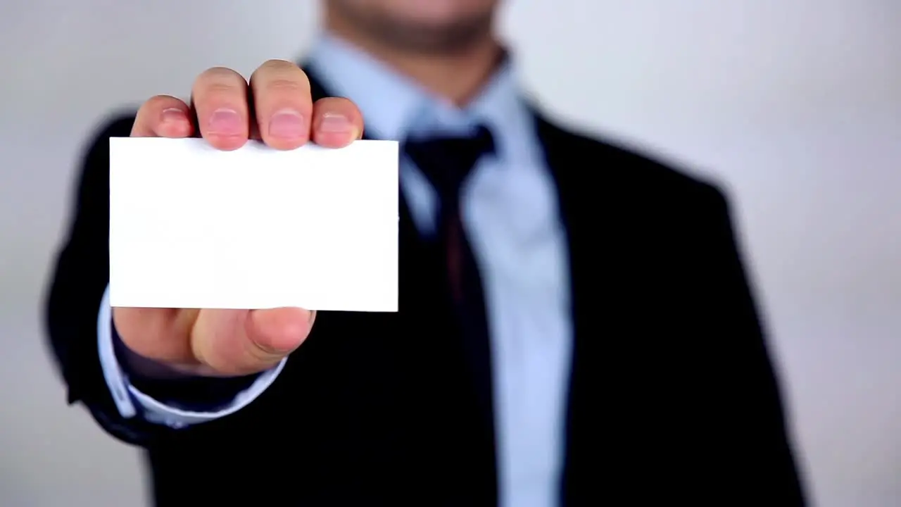 Businessman Presenting And Showing White Placard