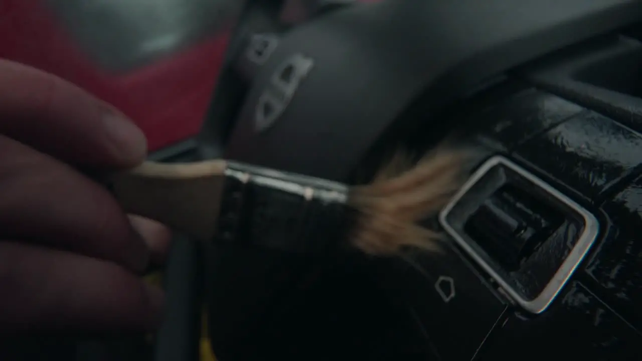 Macro shot of brushing the wheel buttons of a wheel Volvo Semi Truck