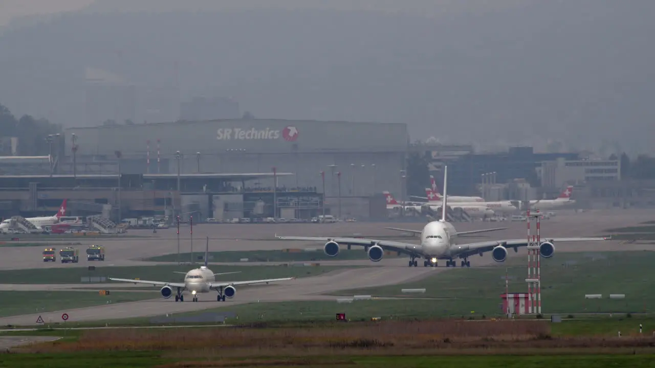 A380 and A320 taxiing on the runway