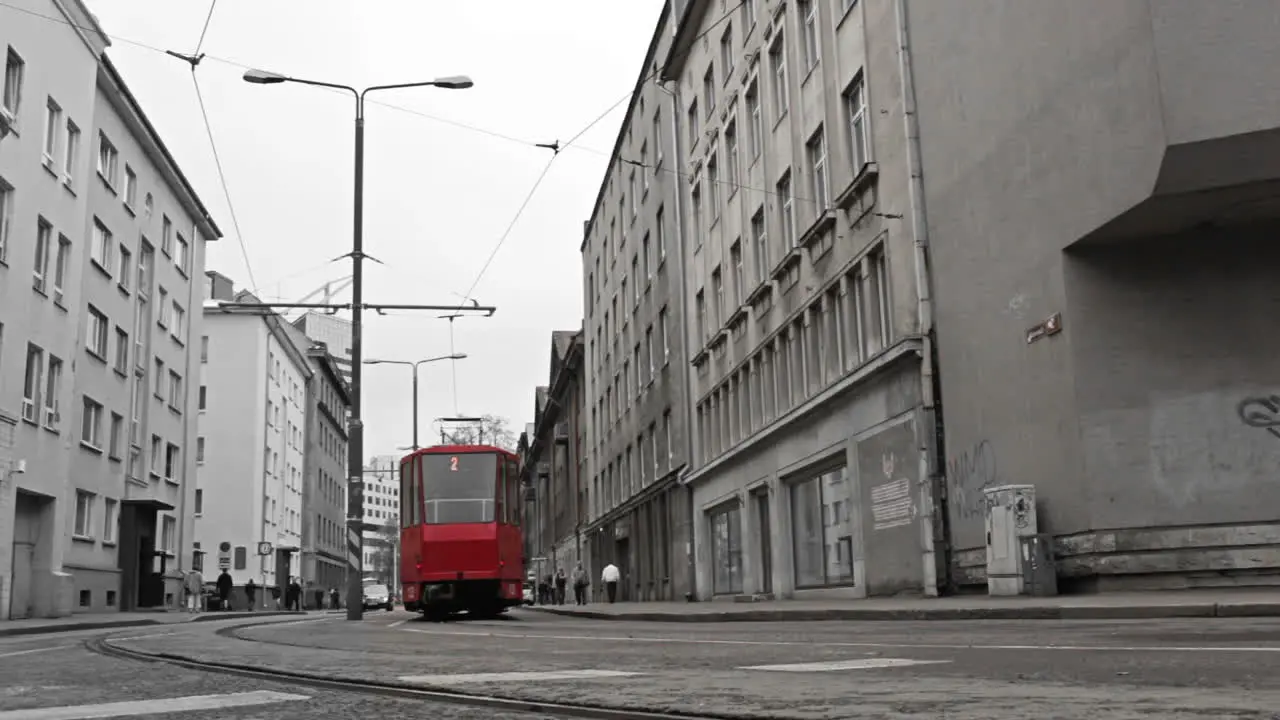 Red tram in the bw city