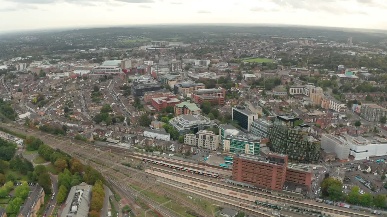 Dolly back aerial shot revealing Watford junction from Watford town