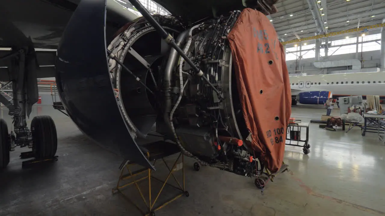 Disassembled jet engine in repair hangar