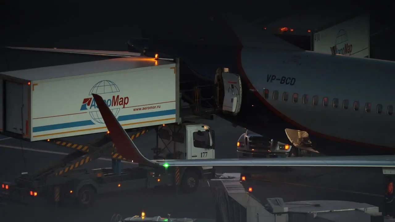 Loading cargo into the plane at night