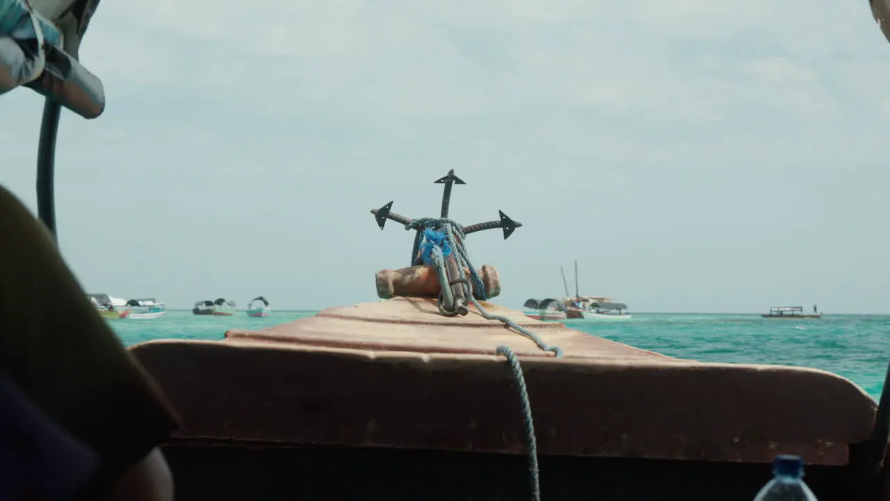 Boat bow sailing through Zanzibar's clear waters