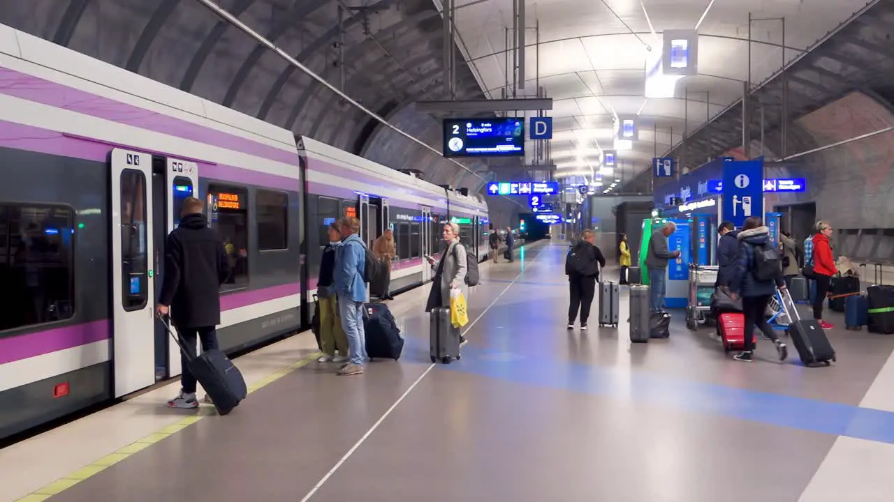 People entering and leaving the Finavia train which connects the Helsinki-Vantaa Airport to downtown Helsinki the Finnish capital