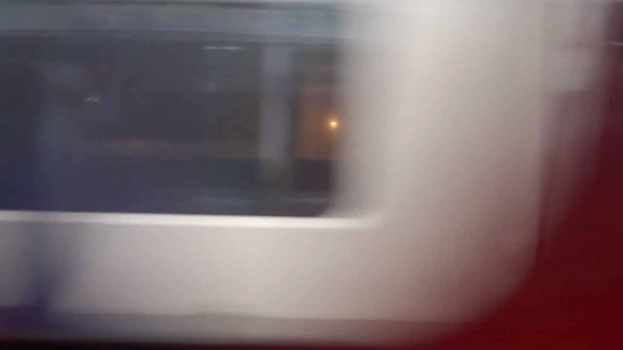 High-speed passenger train whooshing by blurry motion