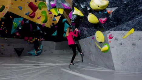 Teenager bouldering in a gym