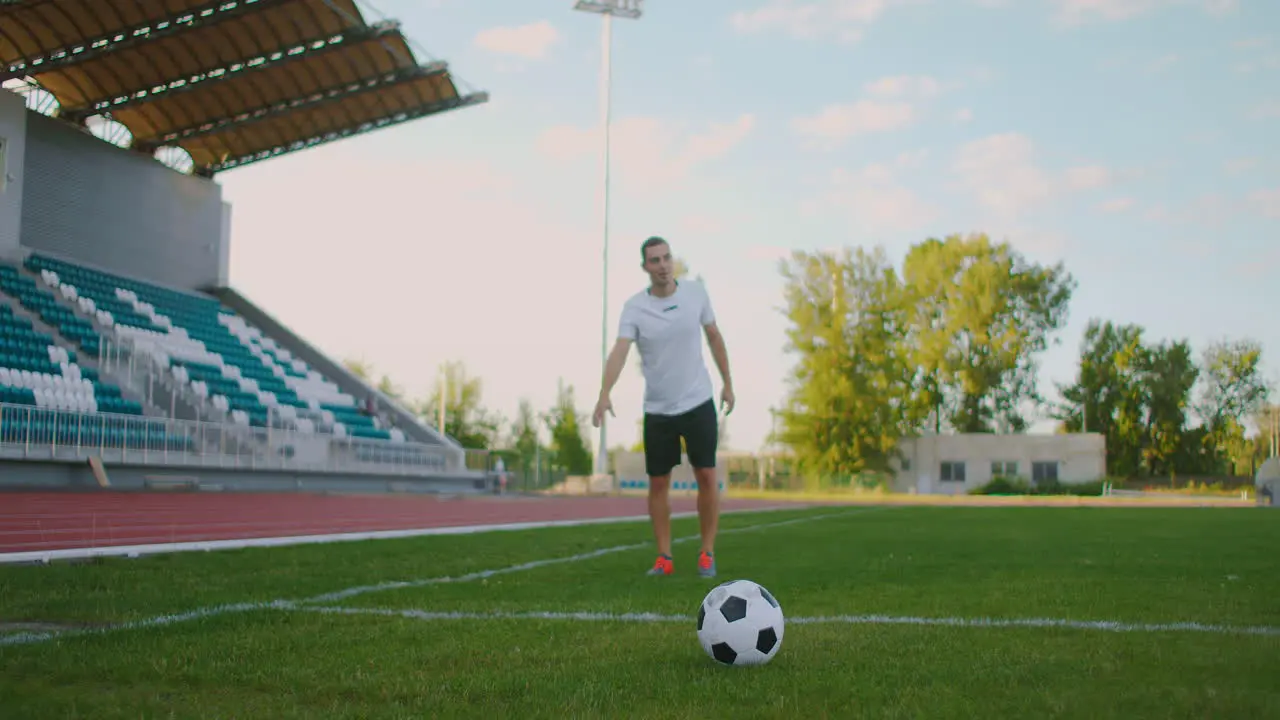 Slow-Mo Soccer Player Kicking A Ball Low angle kick by soccer player Professional Soccer Player About To Kick Football During Soccer Match