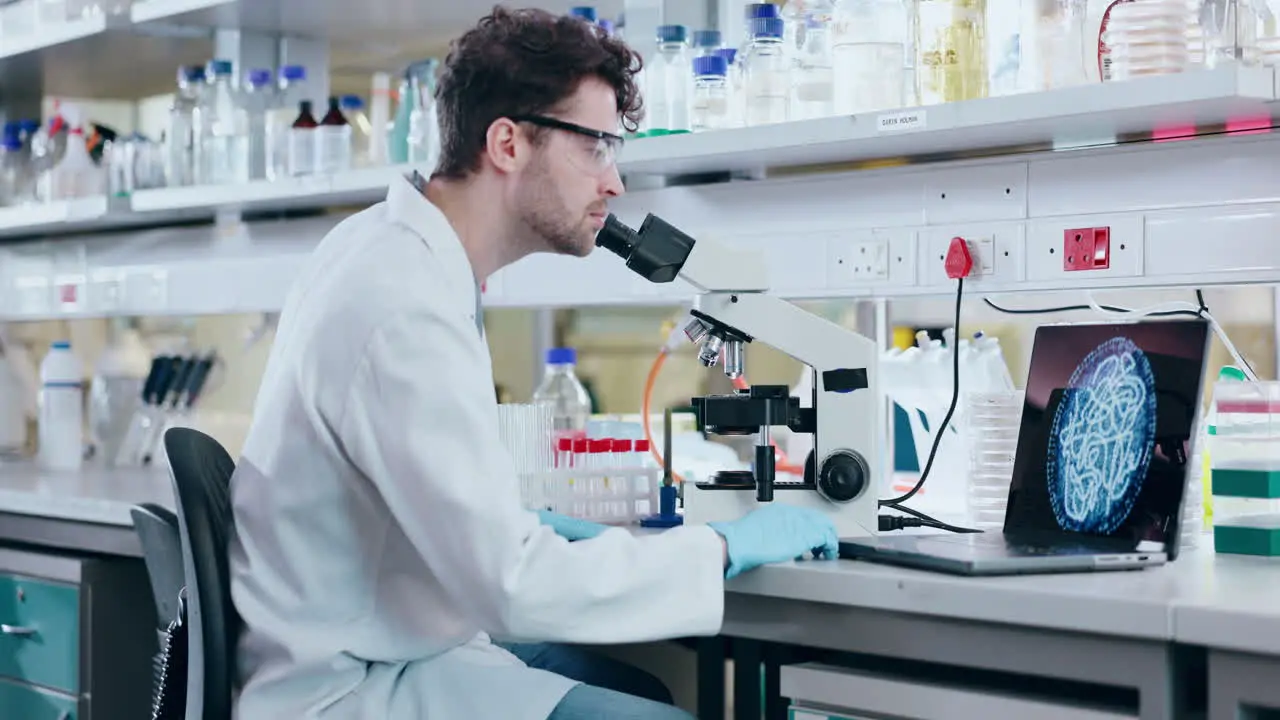 Man scientist and microscope in forensic