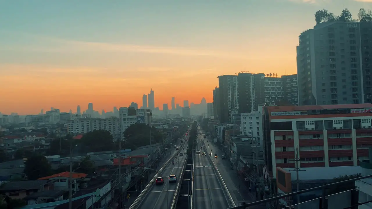 Early Morning Sunrise Over The City Streets Of Bangkok Thailand