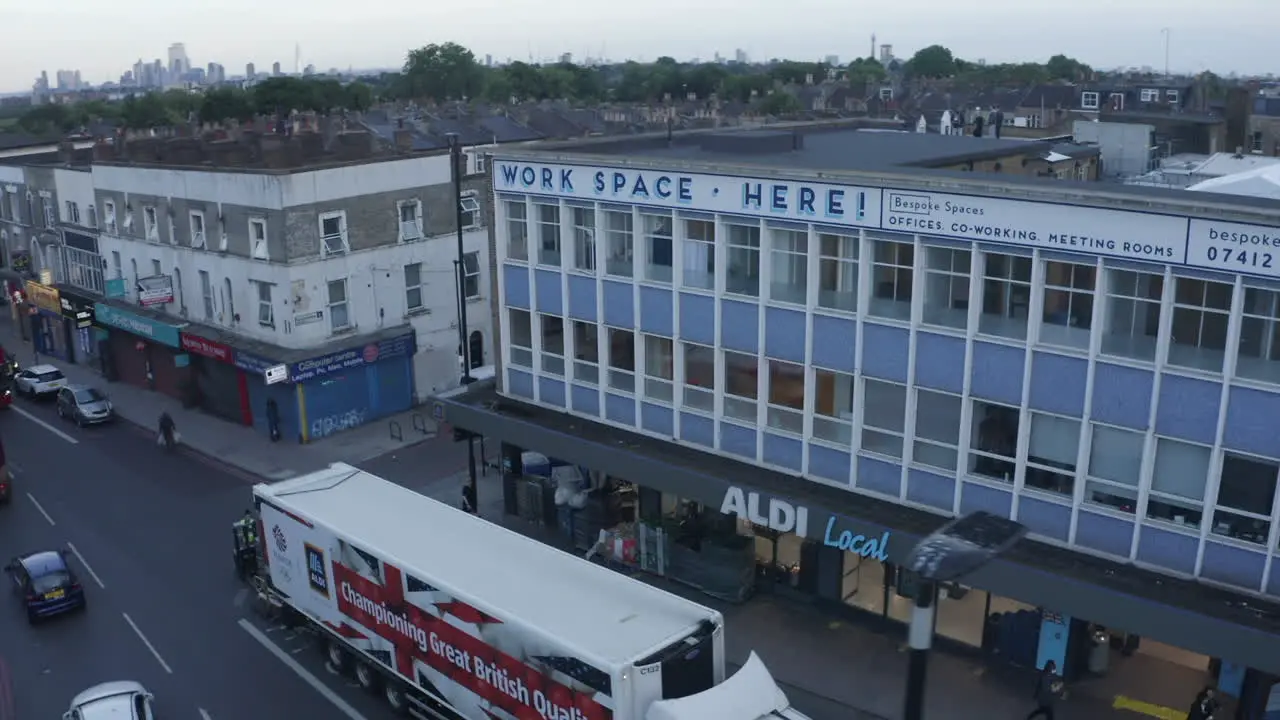 Low street aerial orbits Work space building on Holloway Rd London UK