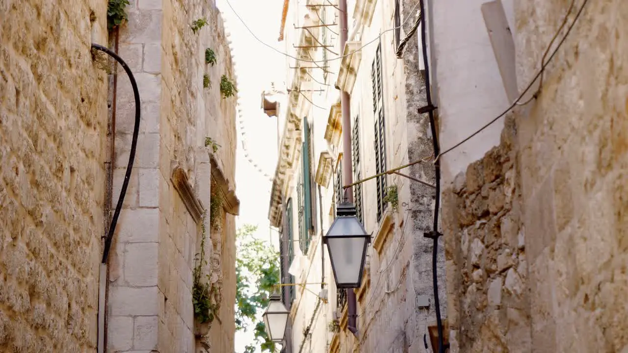 Dubrovnik atmospheric narrow alley of the old town with street lamps