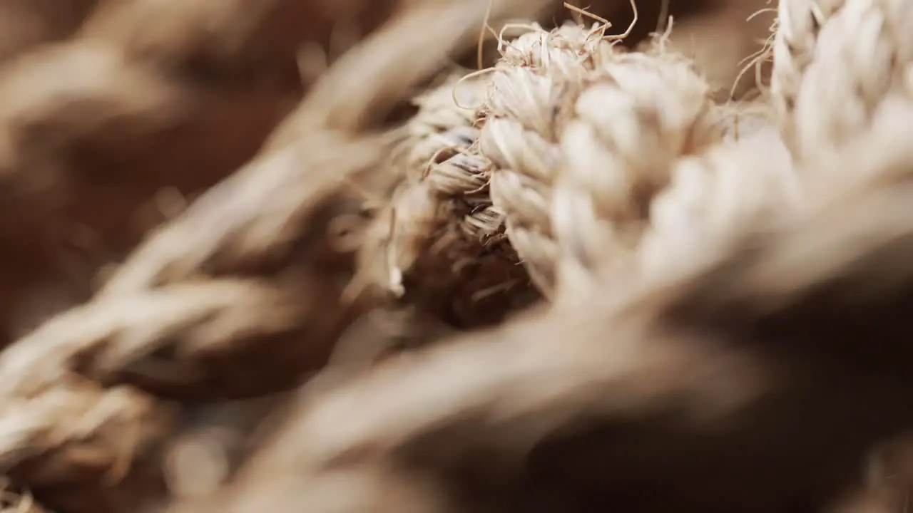 Micro video of close up of brown threads with copy space