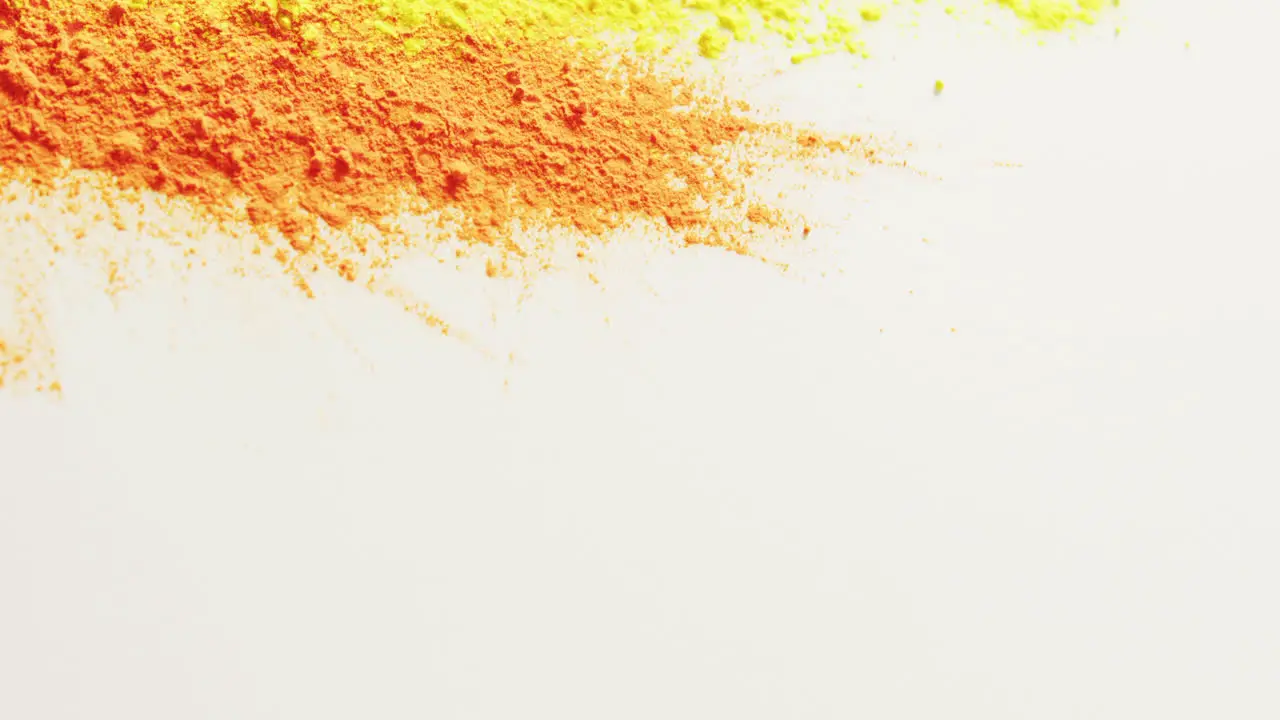 Video of multi coloured powders with copy space on white background