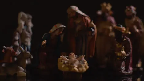 Studio Christmas Concept Of Baby Jesus In Manger With Figures From Nativity Scene 