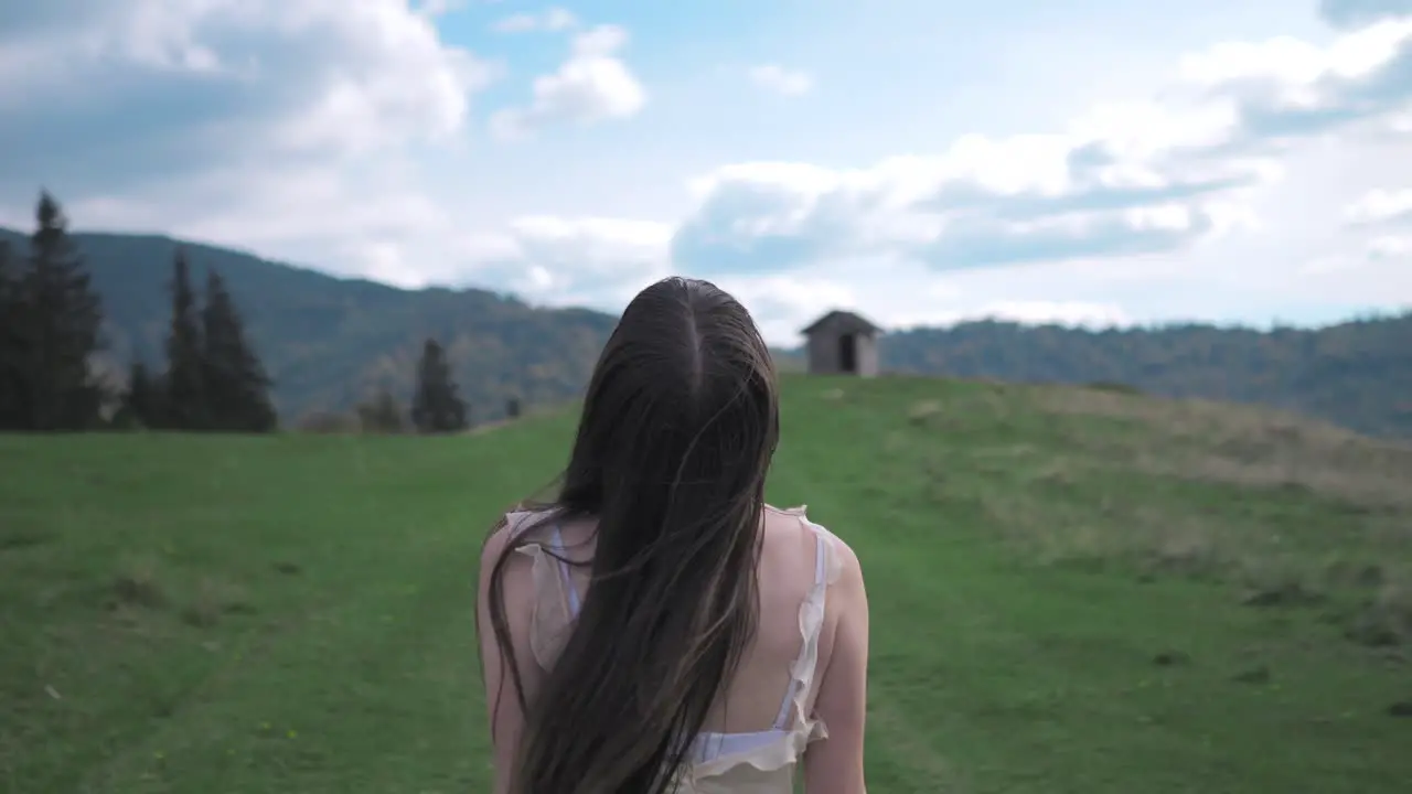 woman in a dress on the mountain