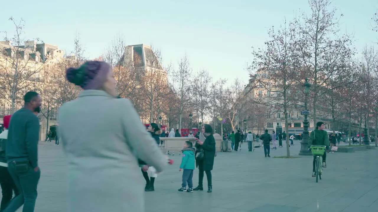 Over population of people in the Parisian squares alternative mobilization of scooter and bicycle warm clothes against the European autumn