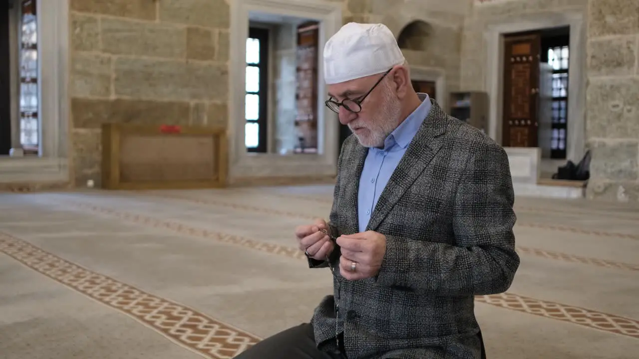 Man praying with rosary