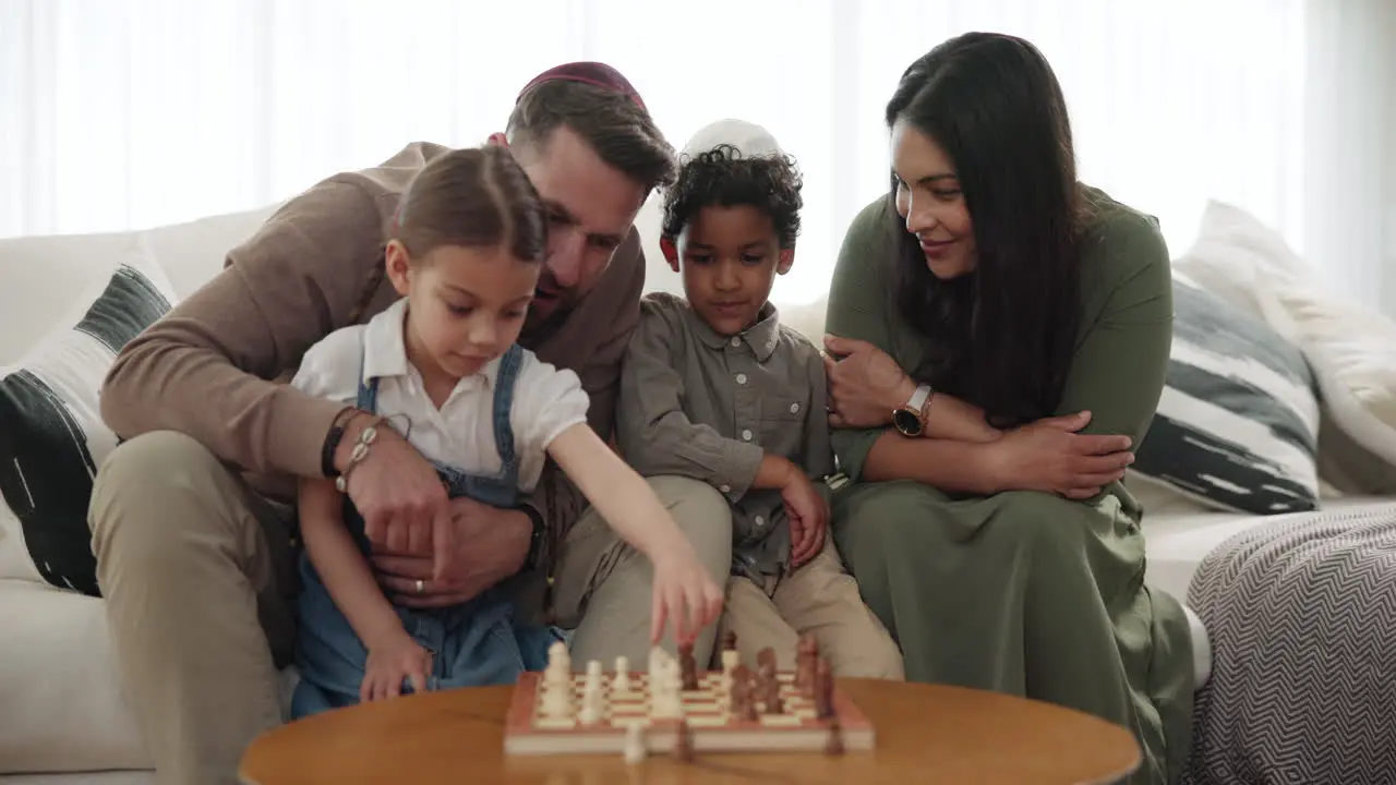 Parents children and chess play in home game