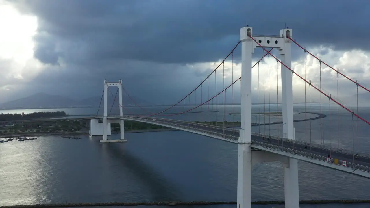 Aerial of Thuan Phuoc suspension bridge with traffic over river in Danang Vietnam