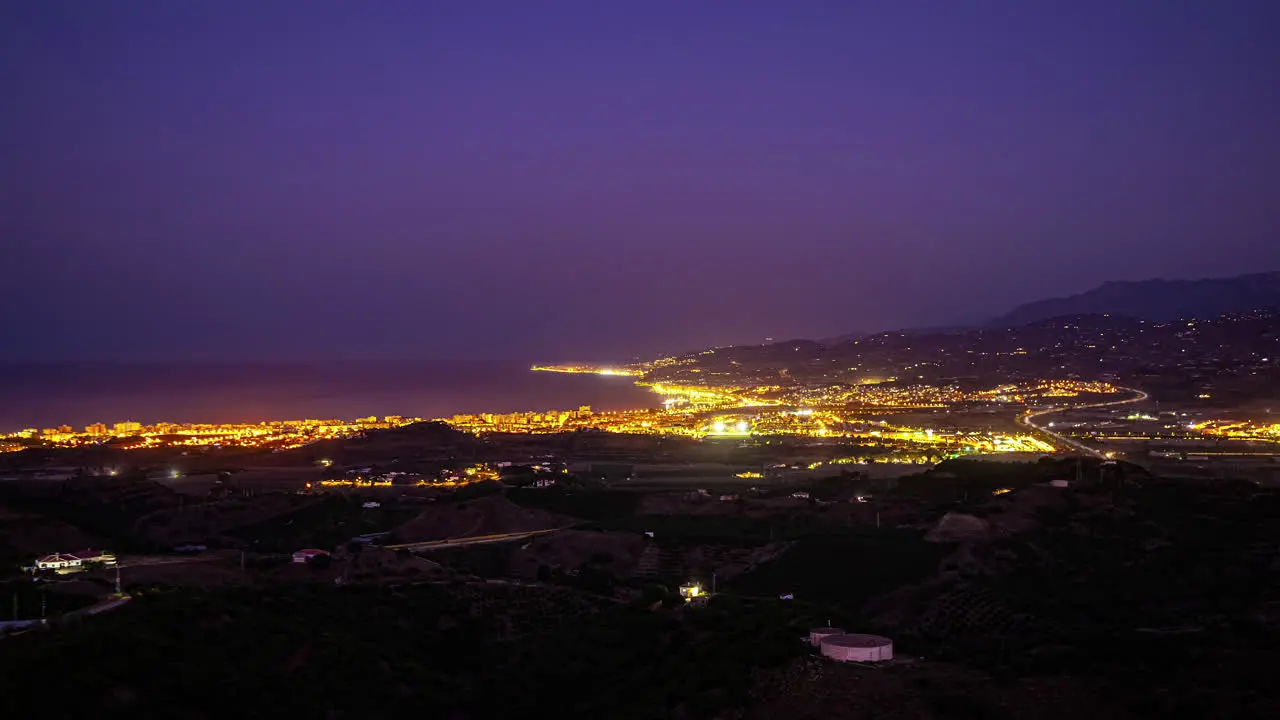 Timelapse of a sunrise from a viewpoint overlooking the city of Malaga