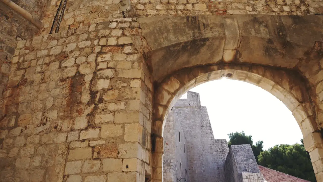 Dubrovnik morning sun illuminating the atmospheric gate of the old town