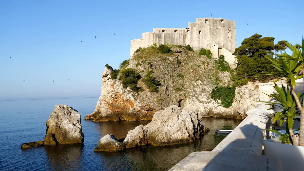 Dubrovnik rocks on the sea and a fortress in the background