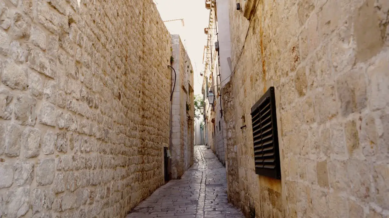 Dubrovnik atmospheric narrow alley of the old town and buildings with shutters