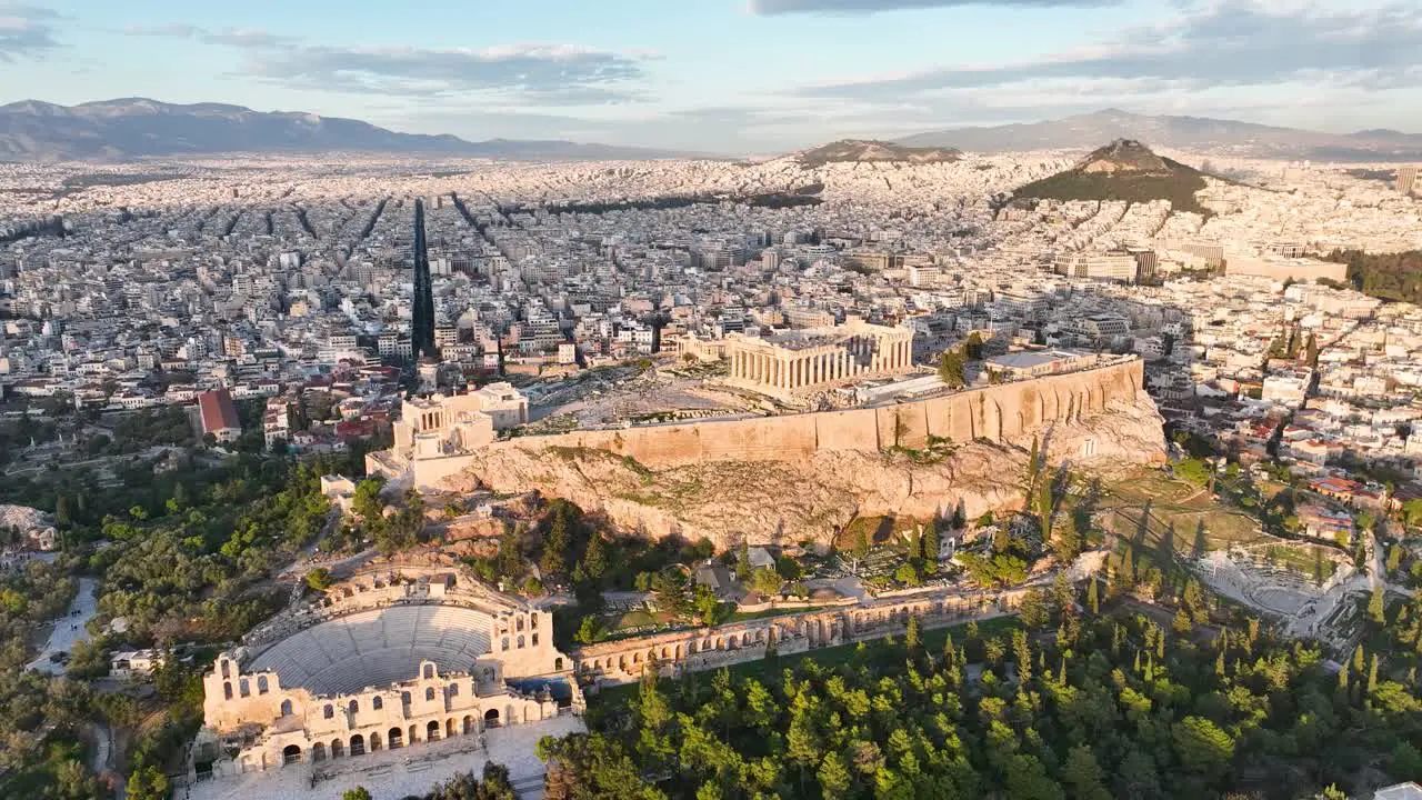 Flying around the Acropolis of Athens Greece on a day with sunshine