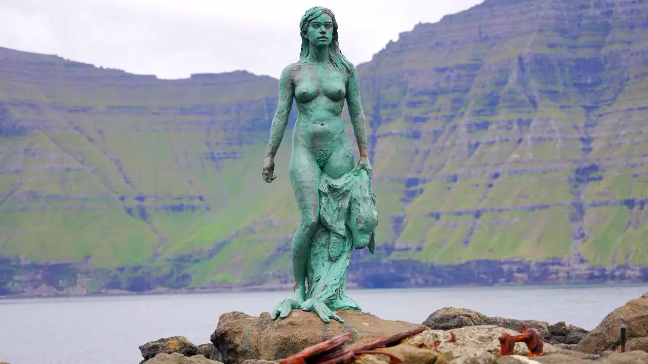 Close up shot reveals Kopakonan Statue with a seal skin on her hands