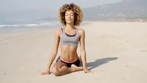 Healthy Young Woman Practices Yoga Outdoor