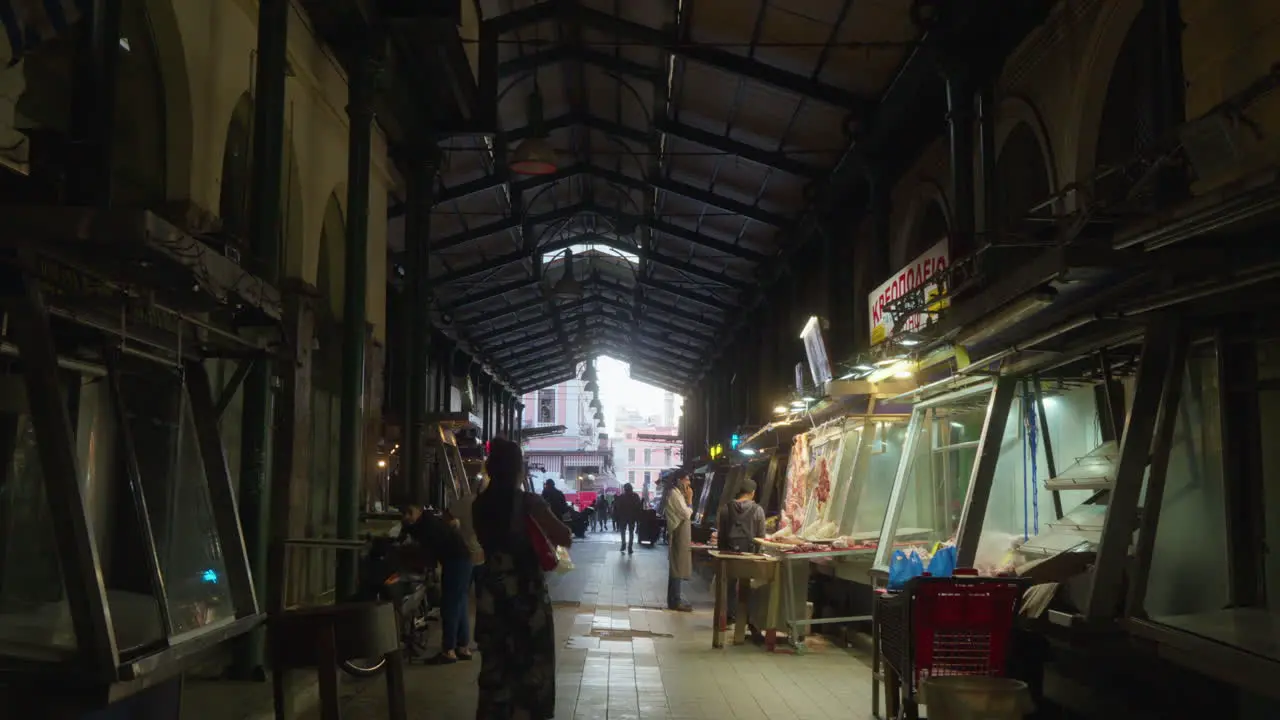 Bustling indoor market with vendors and shoppers on market in Athens Greece