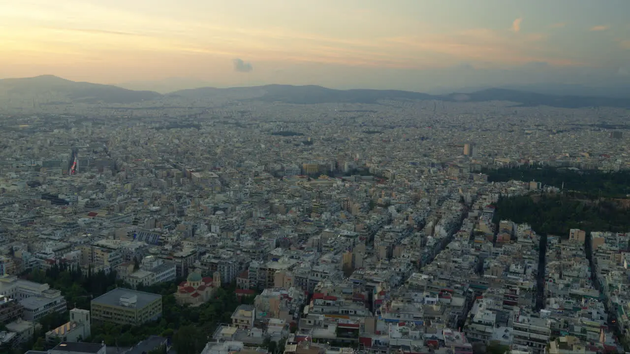 Sunset hues over Athens with a silhouette of Acropolis