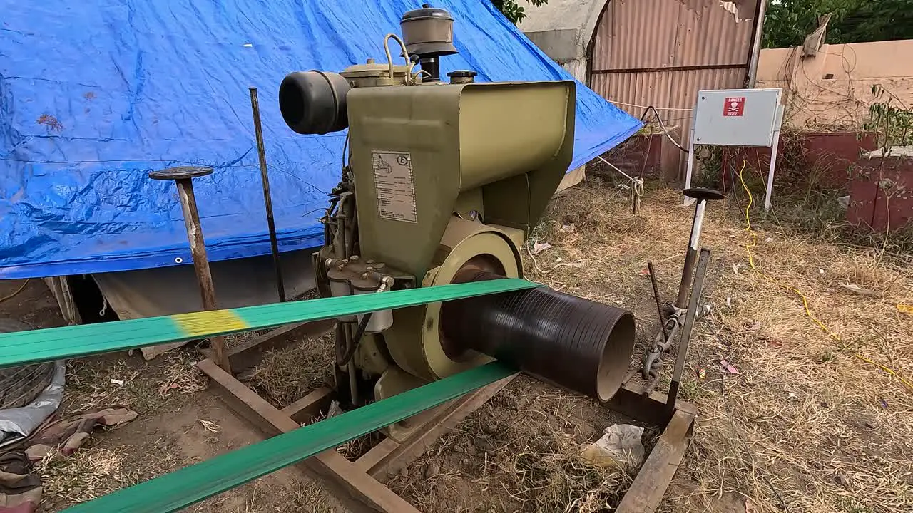 A very old diesel engine this diesel engine is rotating with the help of an abrasive belt