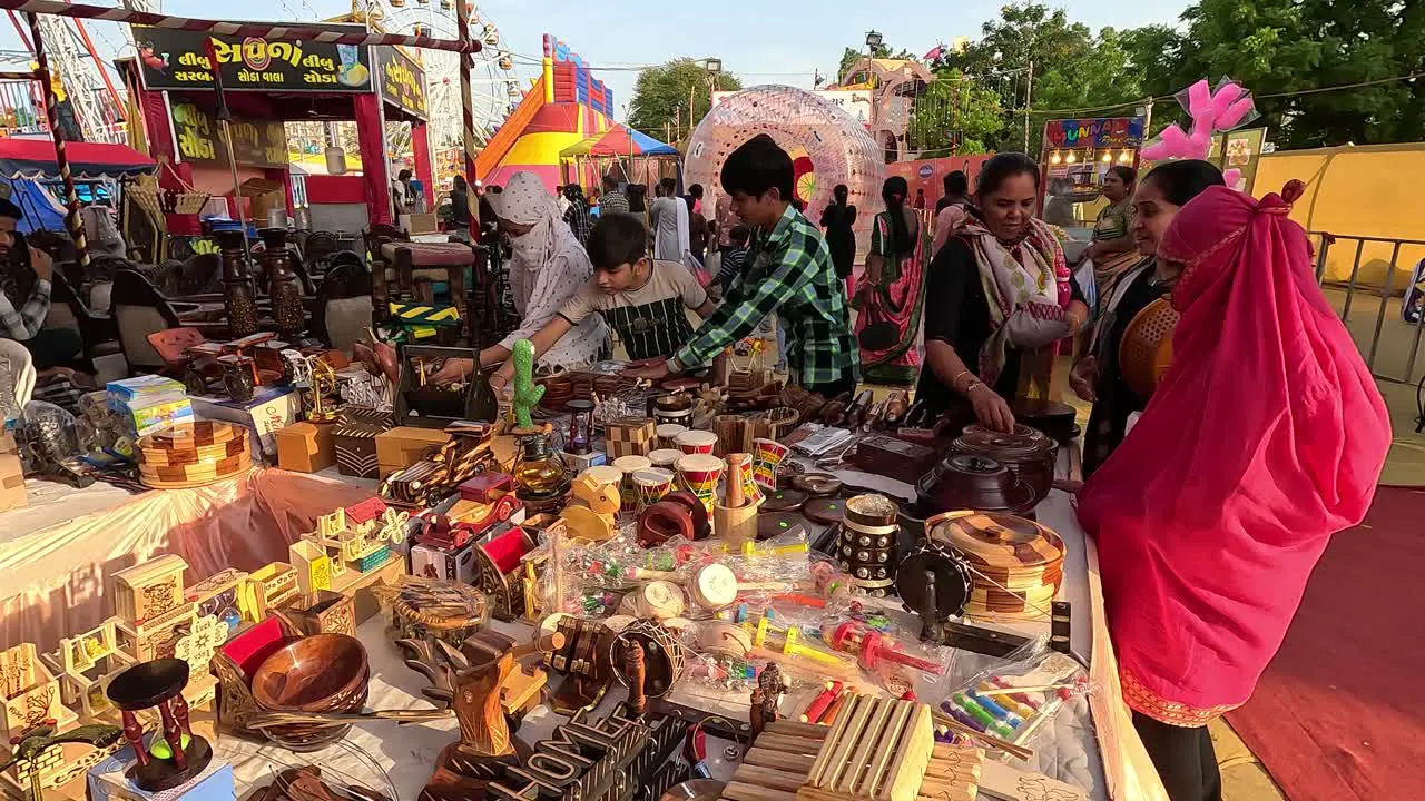 Women are buying household utensils from the sale