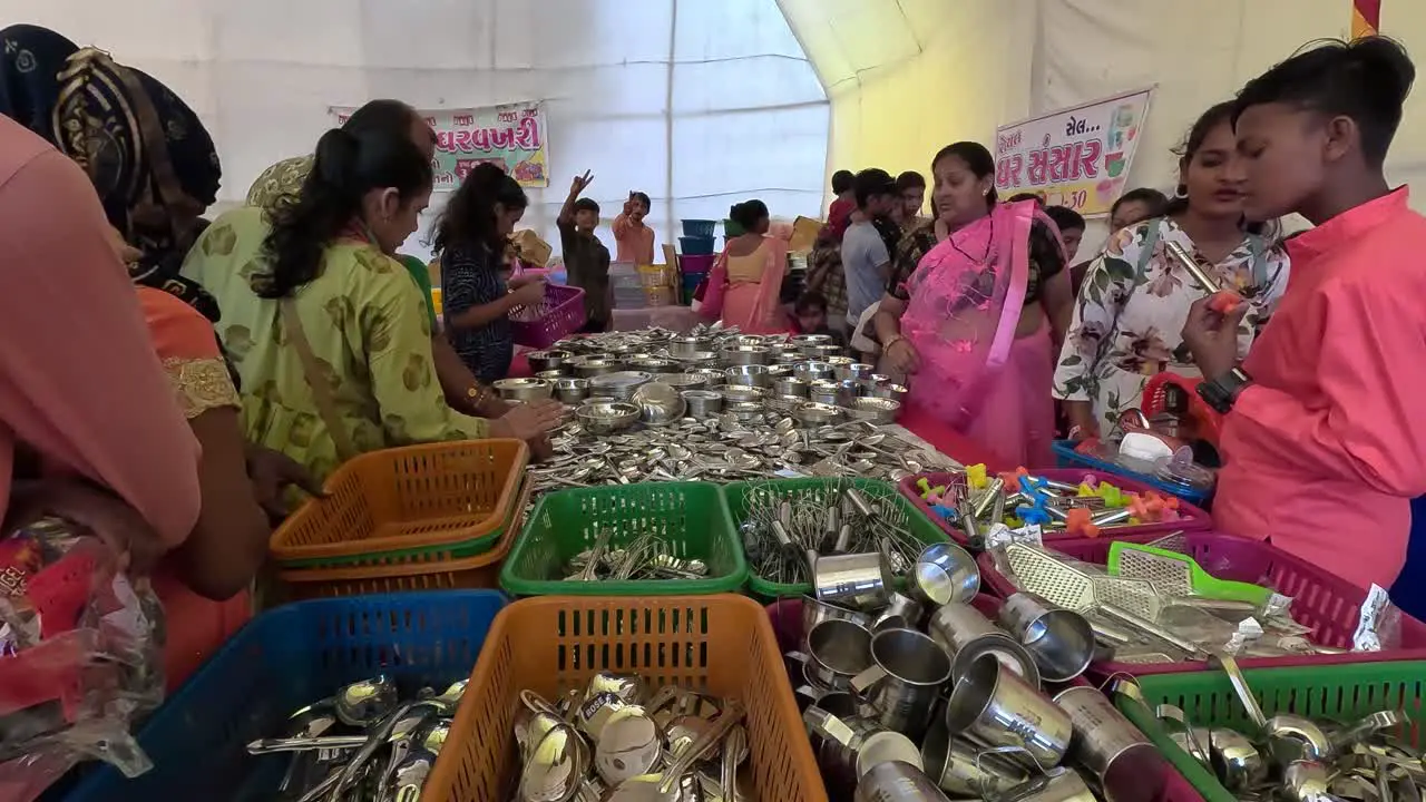 Many women are buying stainless steel household utensils from shops