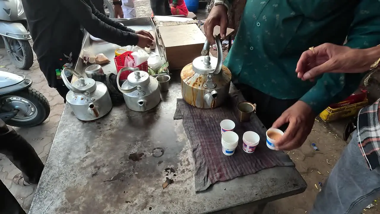 Tea shop scene people are filling tea in paper cups