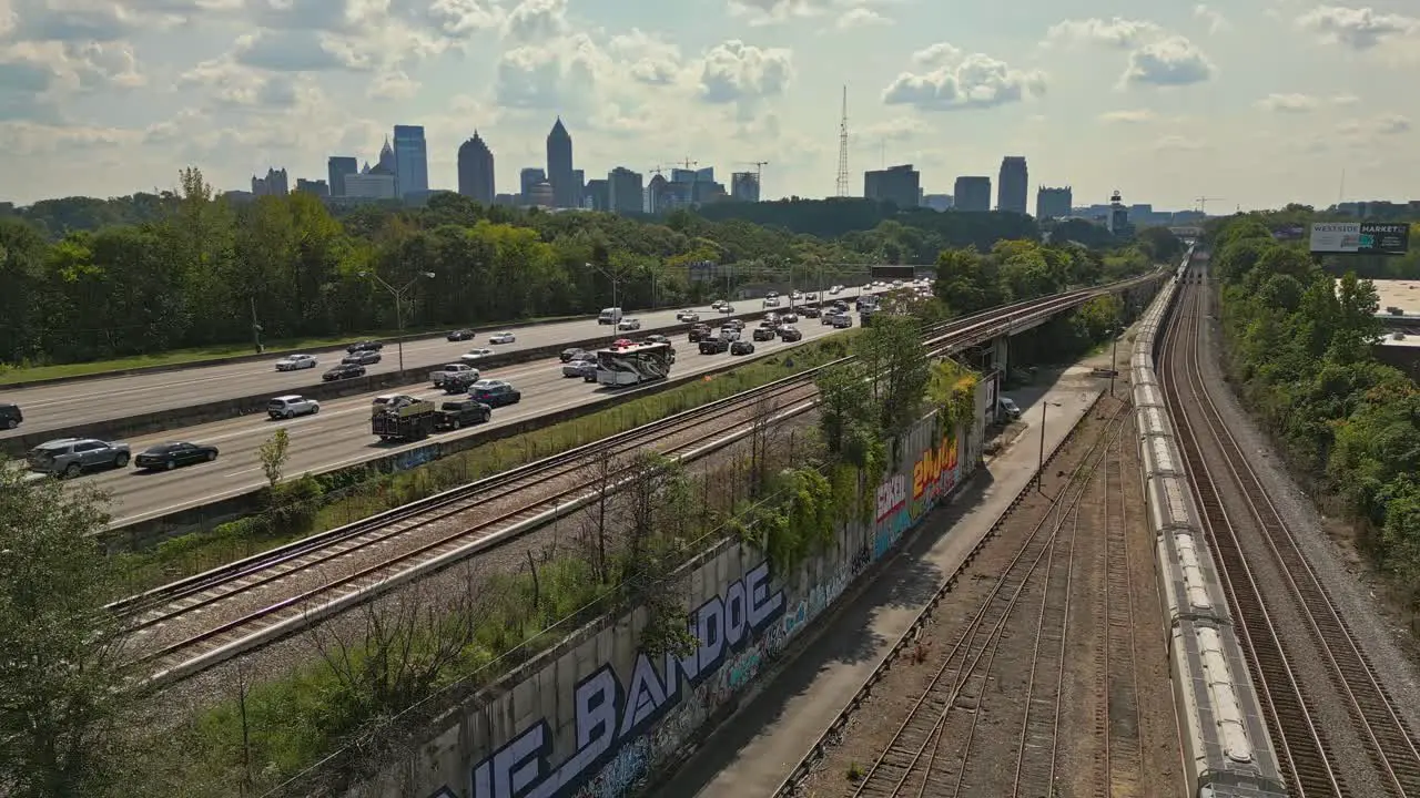 Aerial view of Atlanta city road traffic and passenger train with Downtown Atlanta skyline buildings in background Atlanta traffic Georgia USA