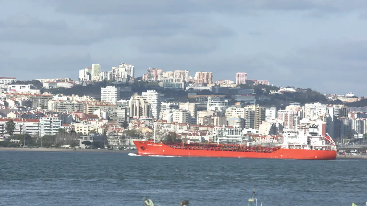 Cargo boat sailing in the river going to the Atlantic ocean