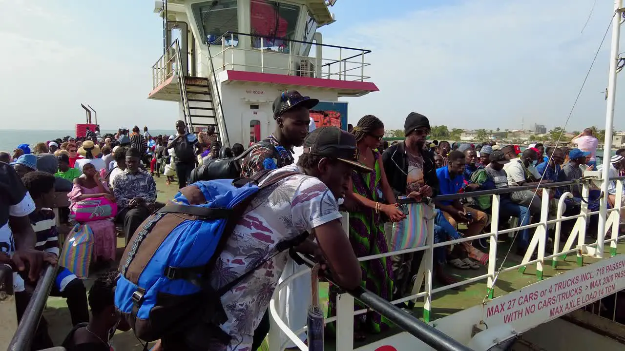 Passenger Crowd On The Deck Of A Ferry Sailing Across Gambia River From Banjul To Barra In Gambia