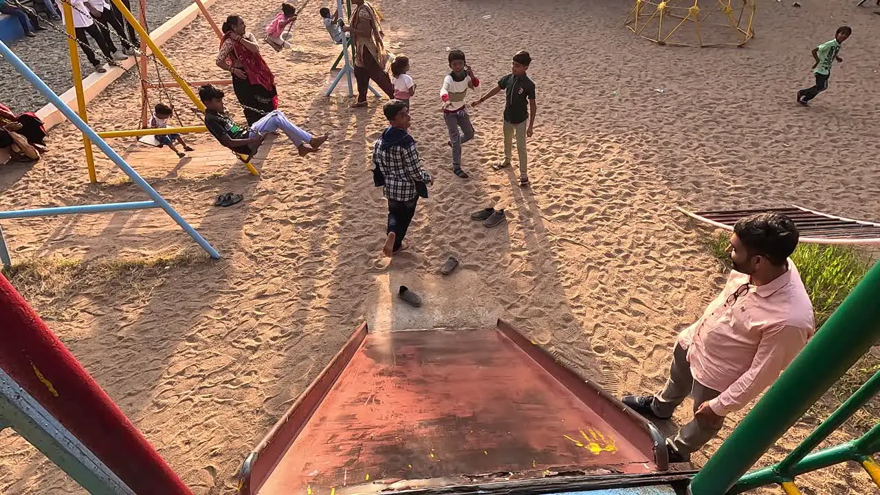 Small children are climbing on the side of the slipper and enjoying the vacation